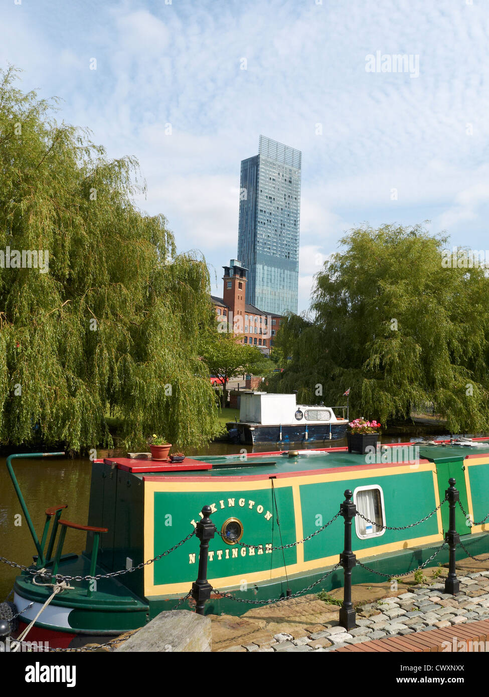 Narrow boat on Bridgewater Canal in Castlefield with Beetham Tower in Manchester UK Stock Photo