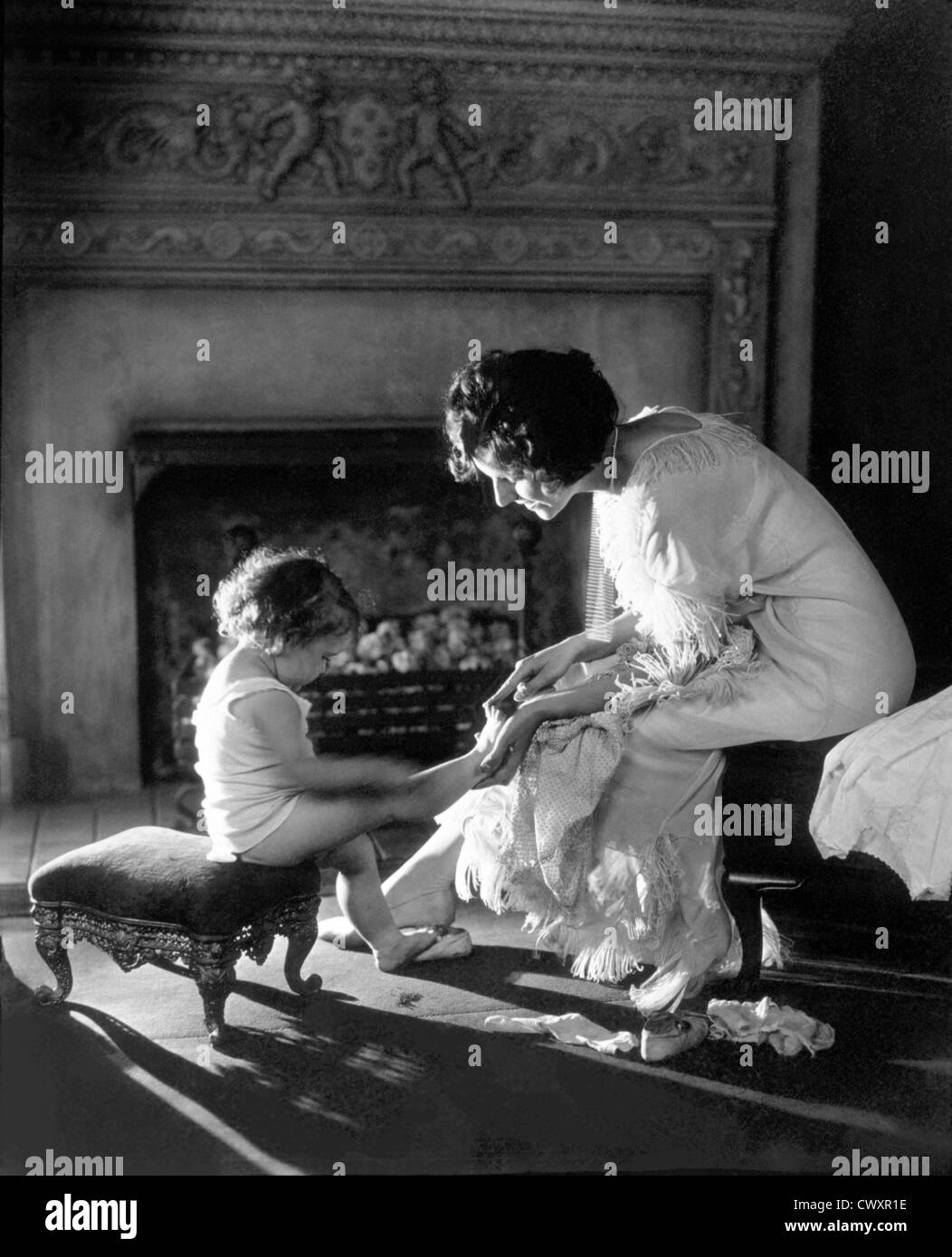 Mother Counting Child's Toes, Circa 1915 Stock Photo