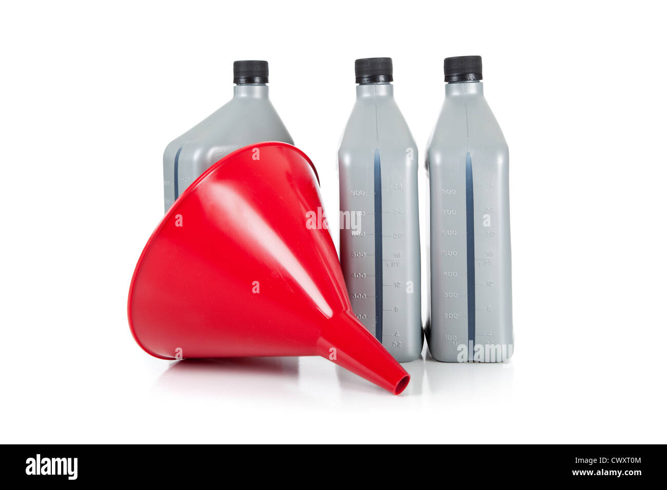 A red funnel and 3 quarts of motor oil on a white background stock