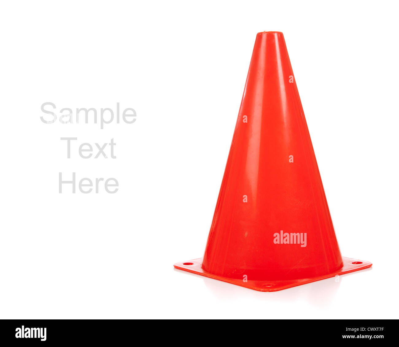 An orange safety cone on a white background with copy space Stock Photo