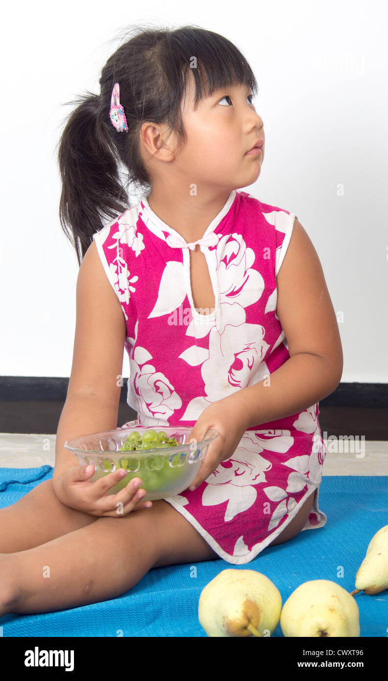 End the fruit plate of the little girl. Stock Photo