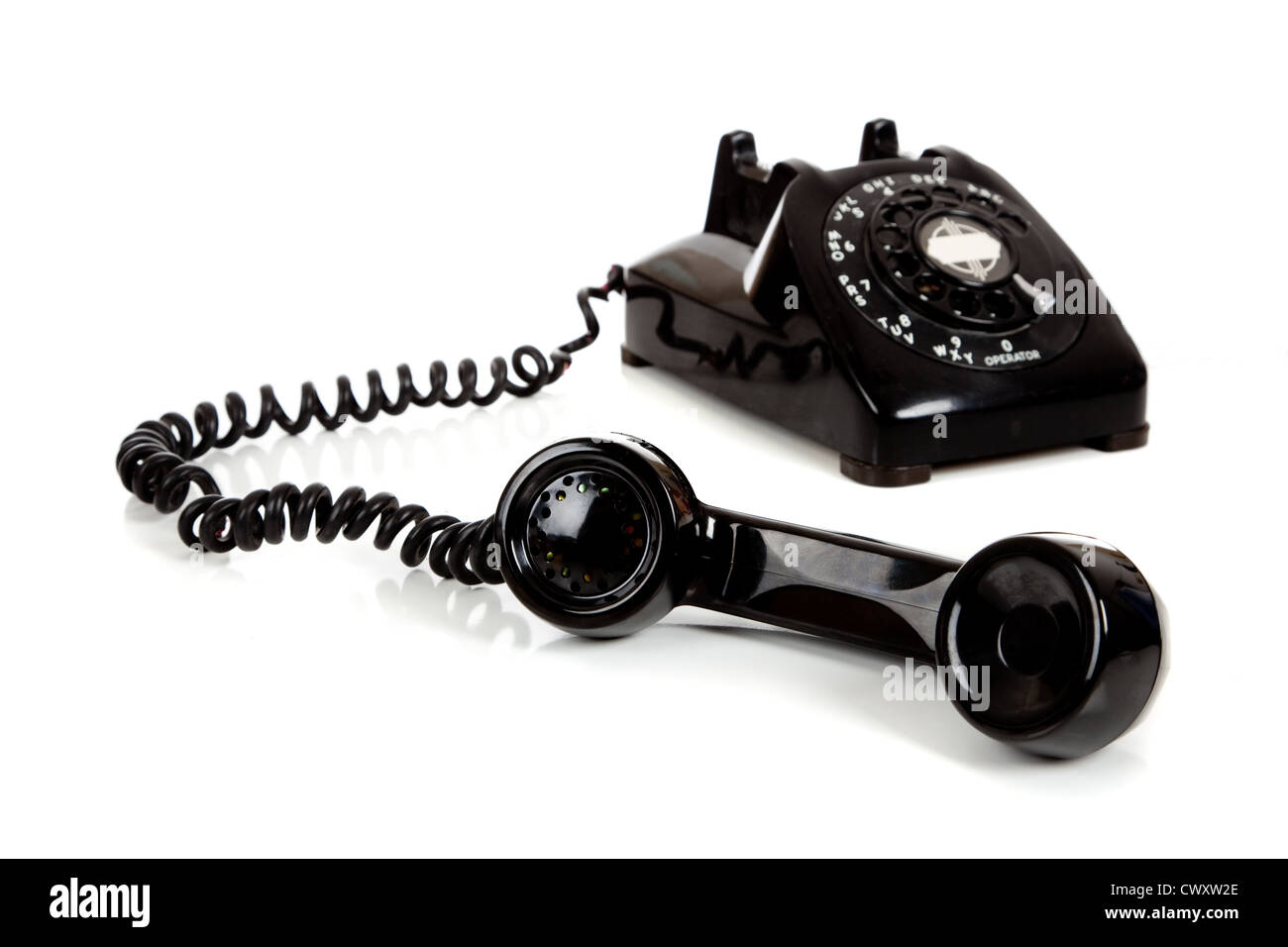 An retro black rotary phone on a white background Stock Photo