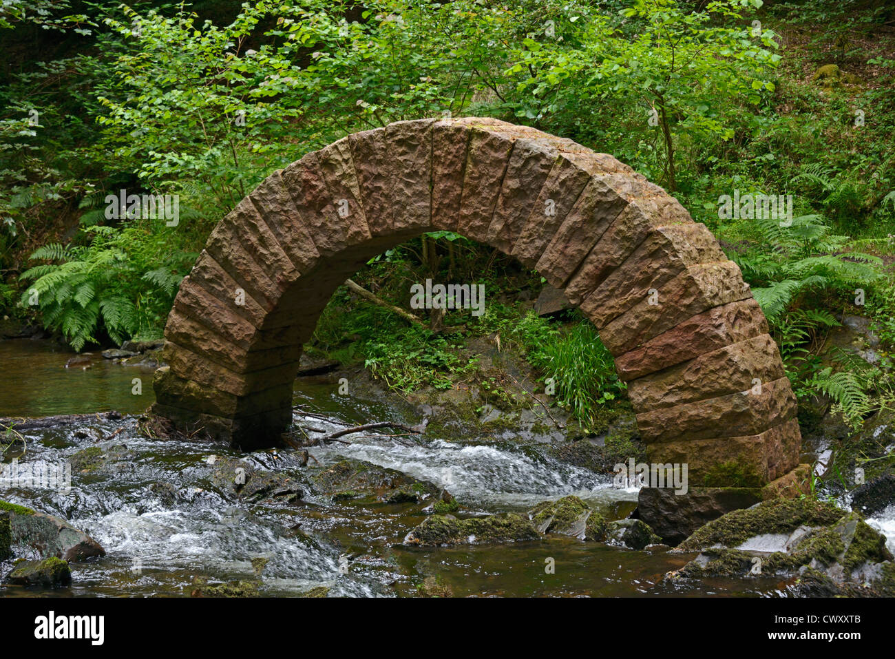 'Leaping Arch', outdoor sculpture by Andy Goldsworthy. Drumlanrig Castle, Queensberry Estate, Dumfries and Galloway, Scotland. Stock Photo