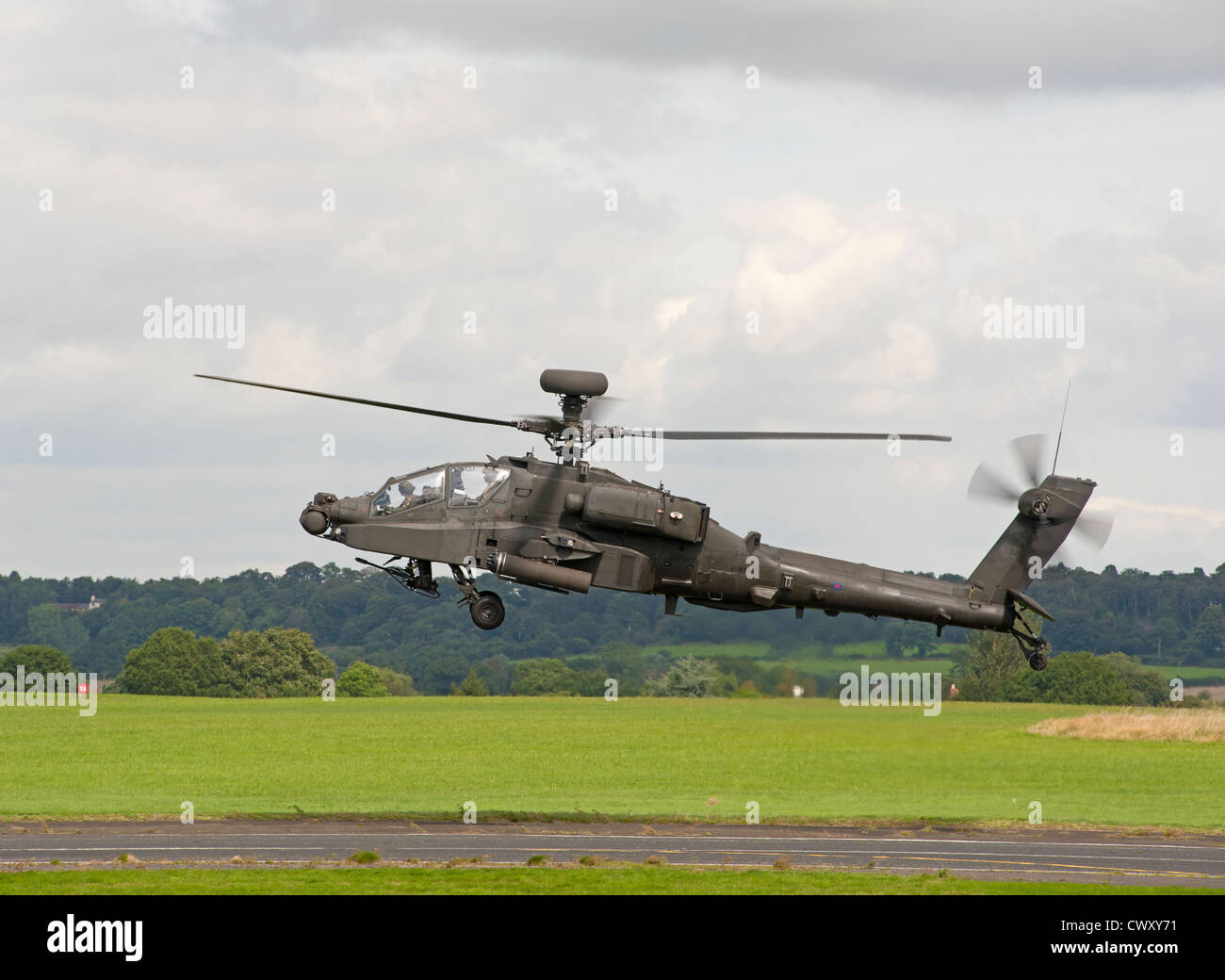 Army Air Corps Military Apache AH 64 Attack Helicopter landing at Army Air Corps Military Apache AH 64 Attack Helicopter landing at