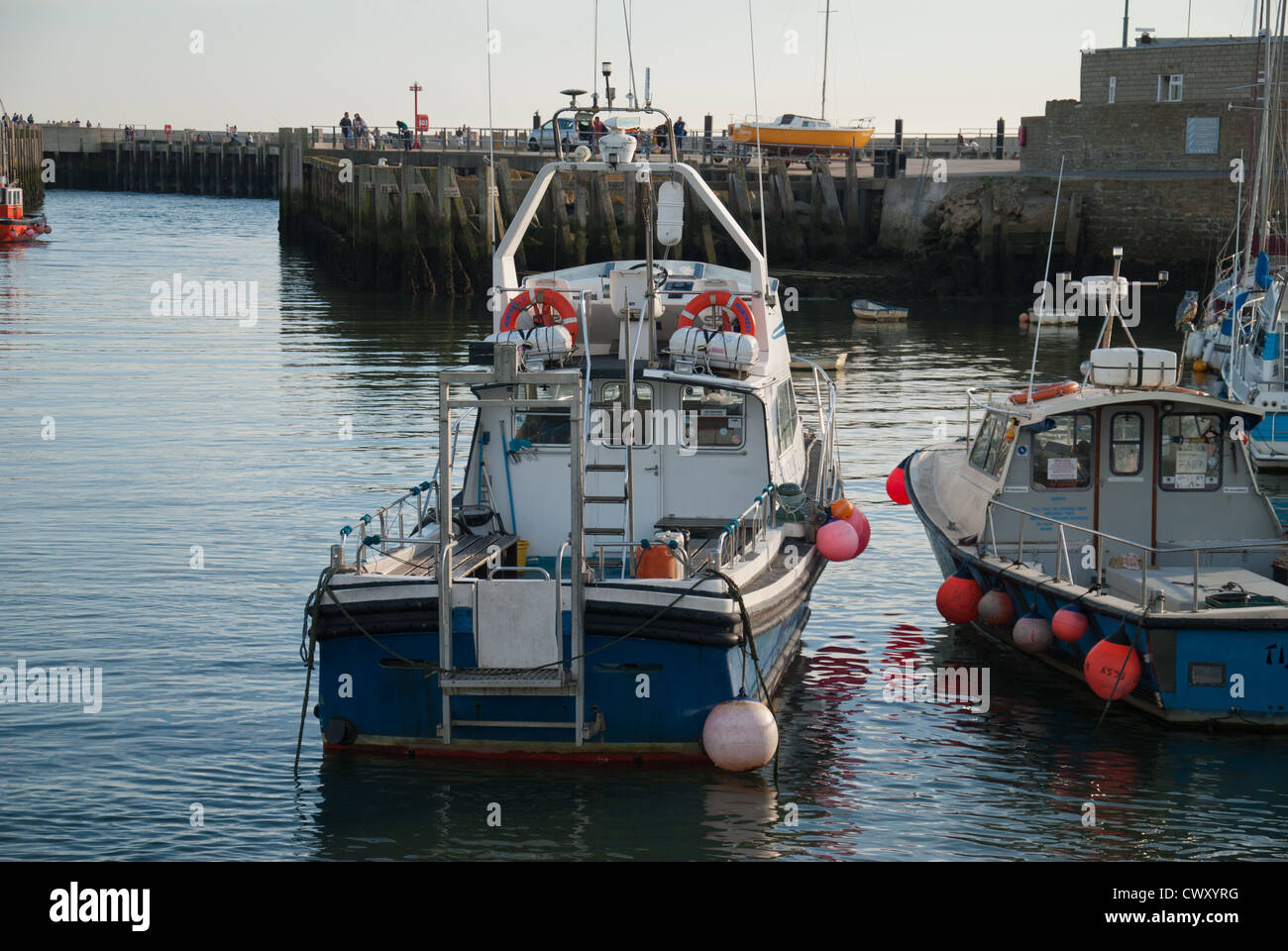 fishing boats west bay harbour Stock Photo - Alamy