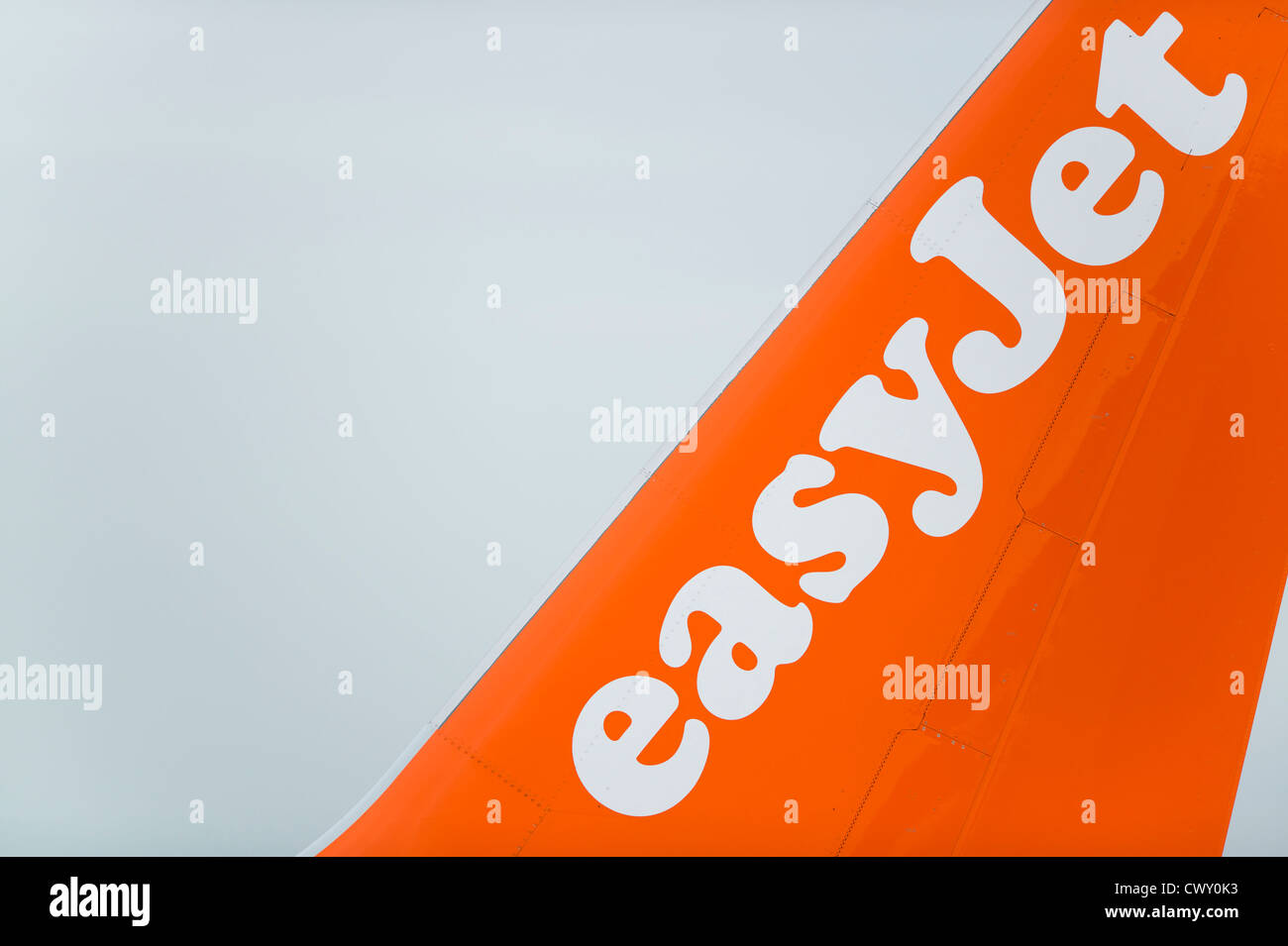 A close up of the EasyJet logo on the tail fin of a passenger aircraft (Editorial use only) Stock Photo