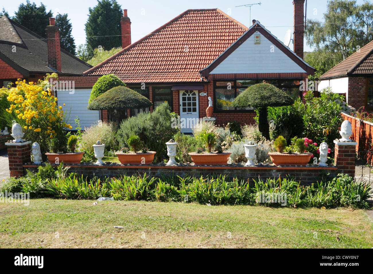Suburban bungalow with garden ornaments, Kent, UK Stock Photo Alamy