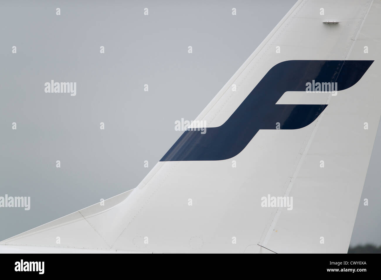 A close up of the Finnair logo on the tail fin of a passenger aircraft (Editorial use only) Stock Photo