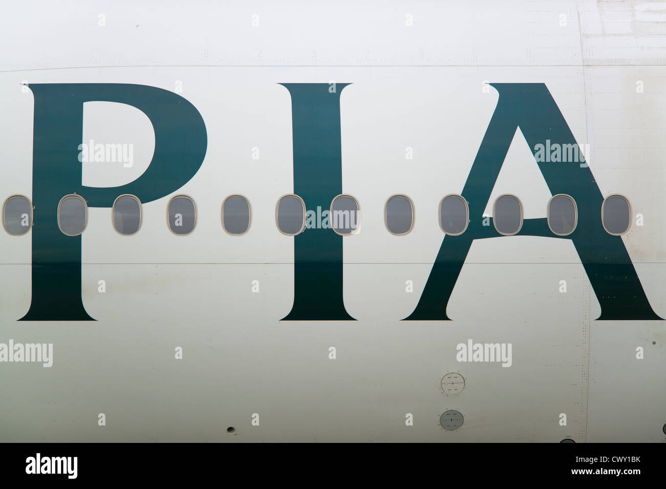 A close up of the Pakistan International Airlines PIA logo on the fuselage of a passenger aircraft (Editorial use only) Stock Photo
