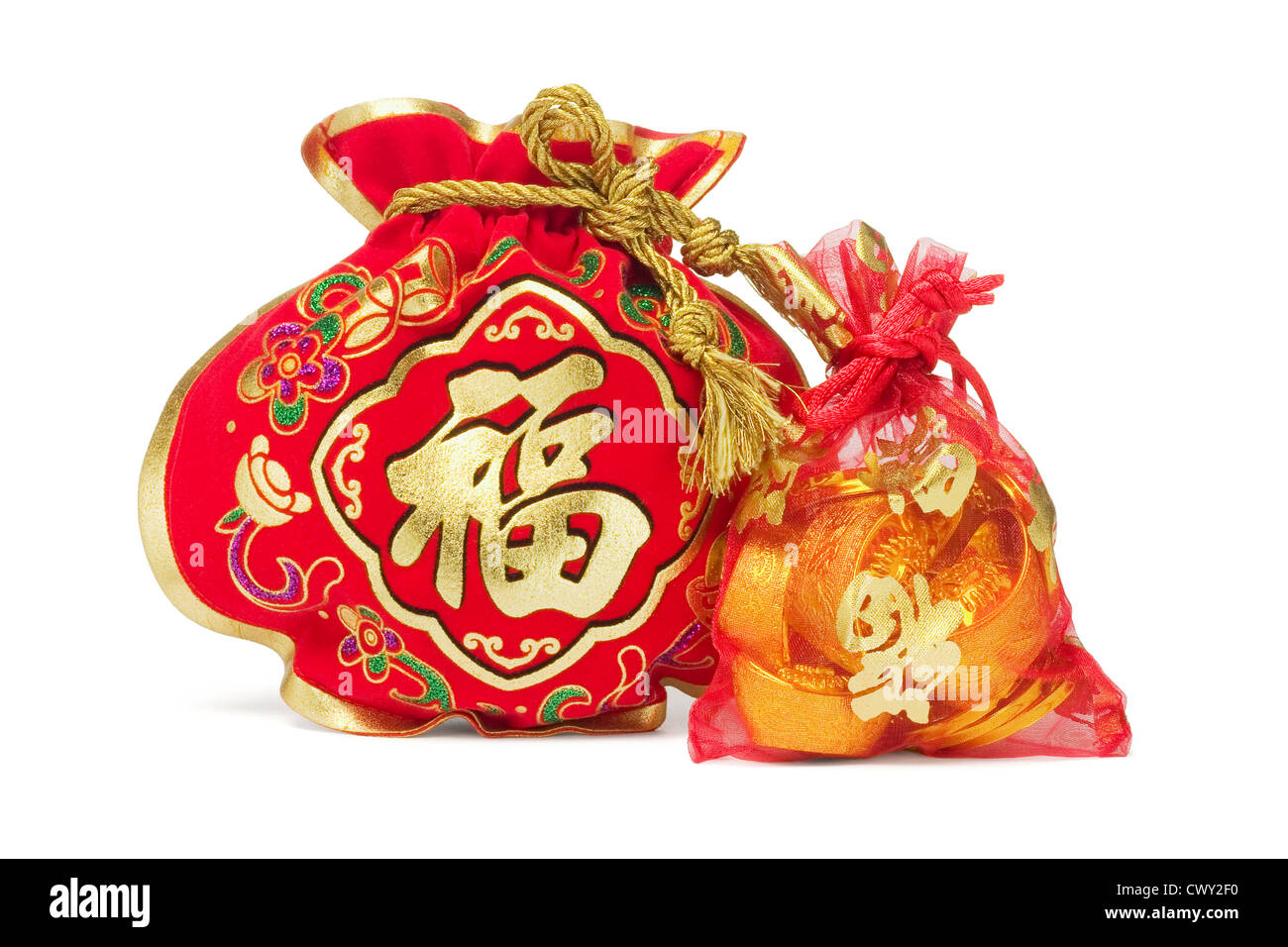 Two Chinese New Year Gift Bags and Gold Ingots on White Background Stock Photo