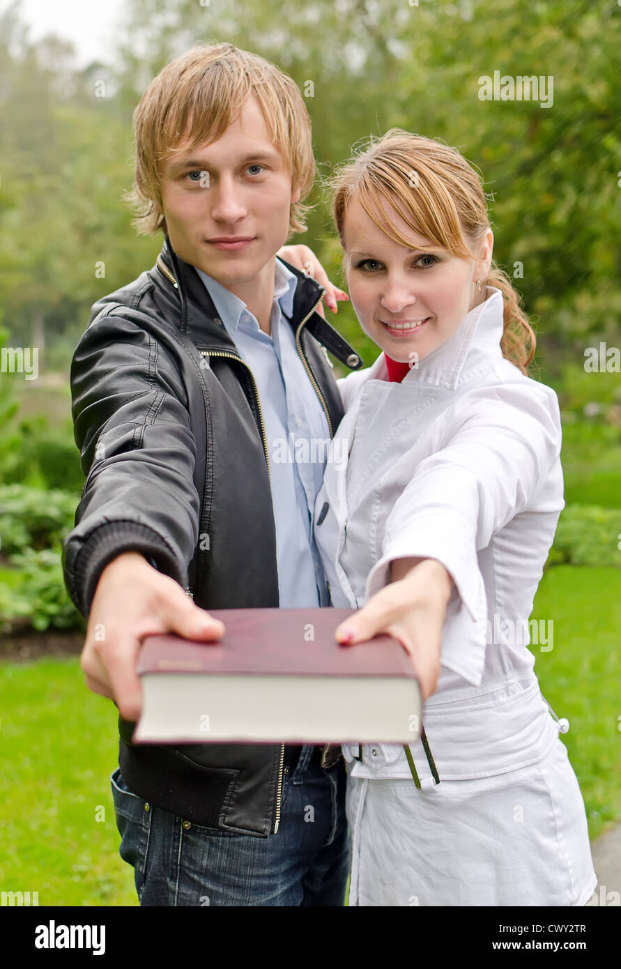 Two students studying outdoors Stock Photo - Alamy