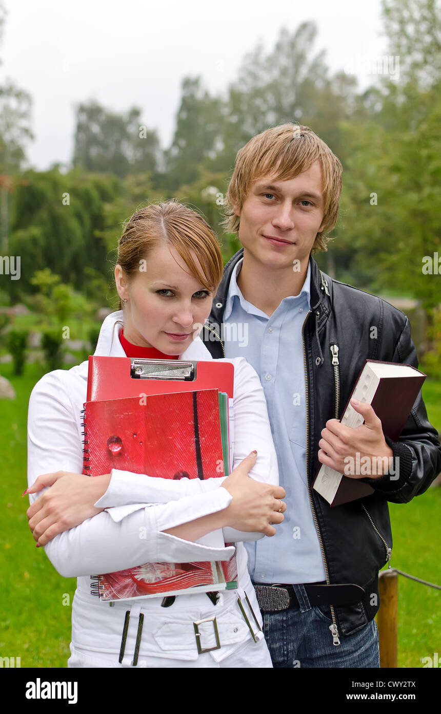 Two students studying outdoors Stock Photo - Alamy