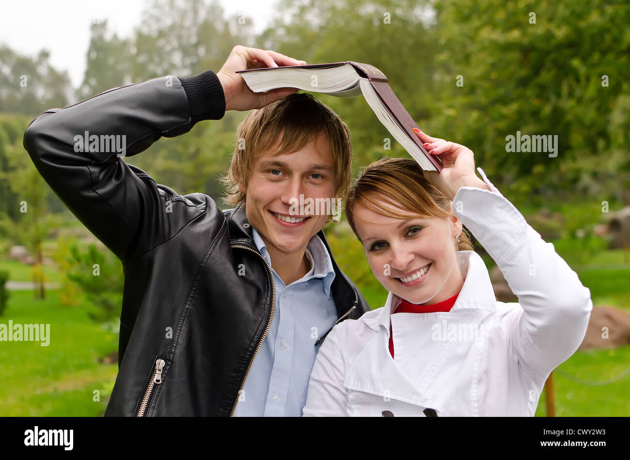 Two students studying outdoors Stock Photo - Alamy