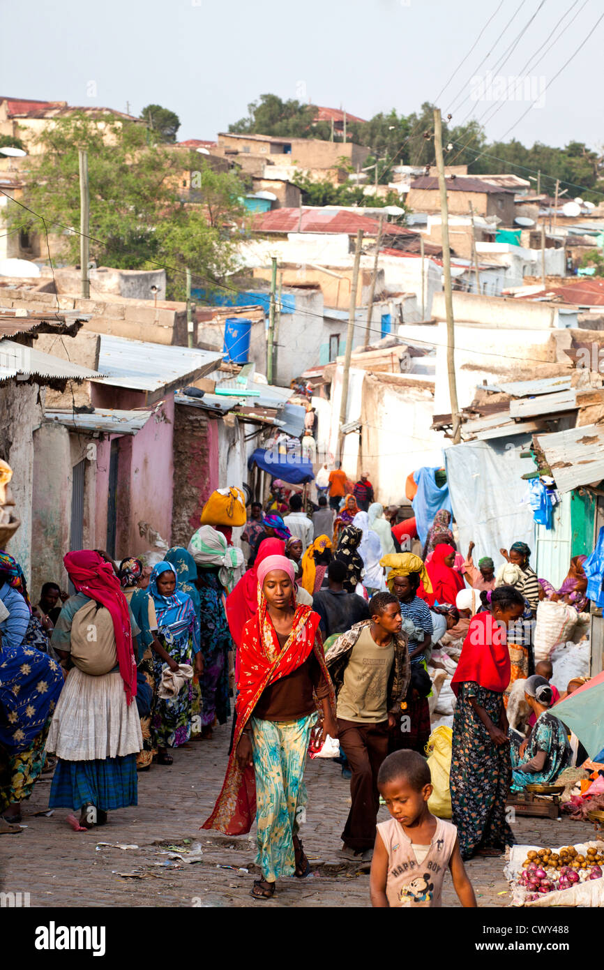 Colorfully dressed girl in a bustling street Harar Ethiopia. Stock Photo