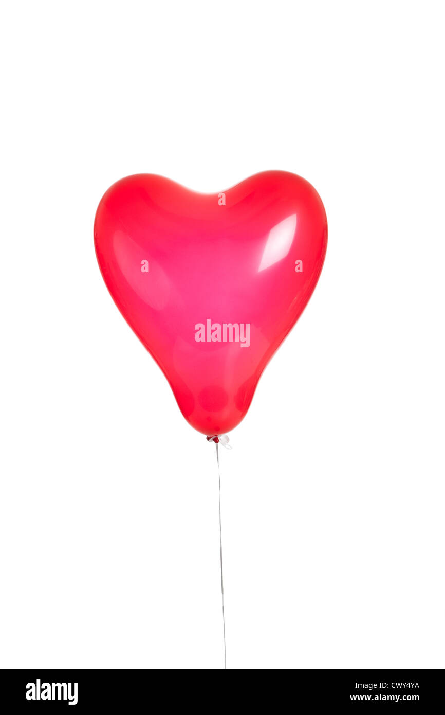 A red heart shaped balloon on a white background Stock Photo - Alamy
