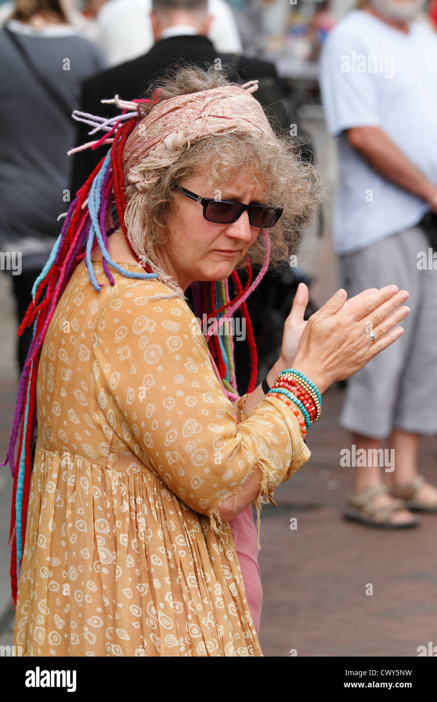 Dancing and clapping woman at the Faversham hop festival Stock Photo