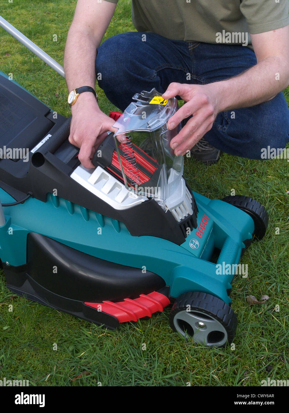 Caucasian Man Changing a Rechargeable Battery on a Bosch Rotak Rechargeable  Lawnmower MODEL RELEASED Stock Photo - Alamy