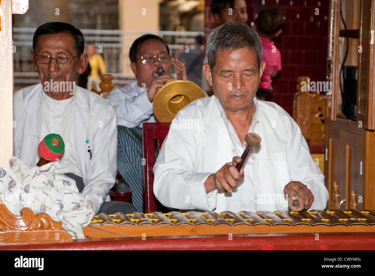 Myanmar, Mandalay. Mahamuni Buddhist Temple. Musicians Playing