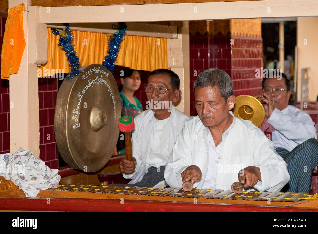 Myanmar, Mandalay. Mahamuni Buddhist Temple. Musicians Playing
