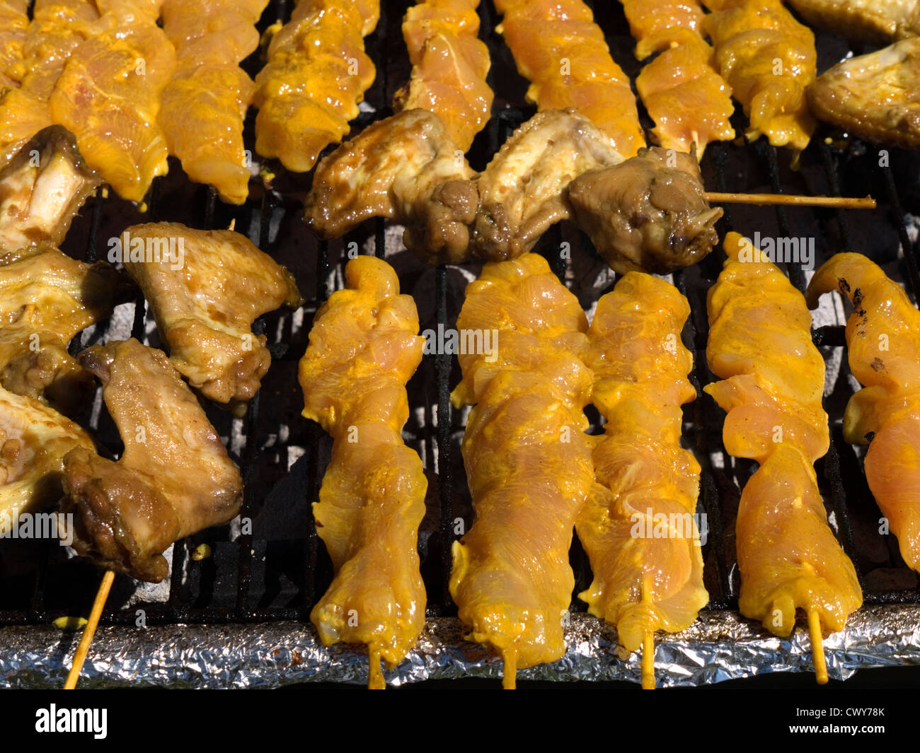 sate on sale at a multicultural festival Stock Photo