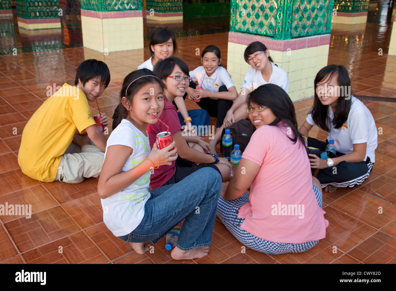 Myanmar, Burma. Sutaungpyei Pagoda, Mandalay Hill Temple. Young Tourists from Singapore. Stock Photo