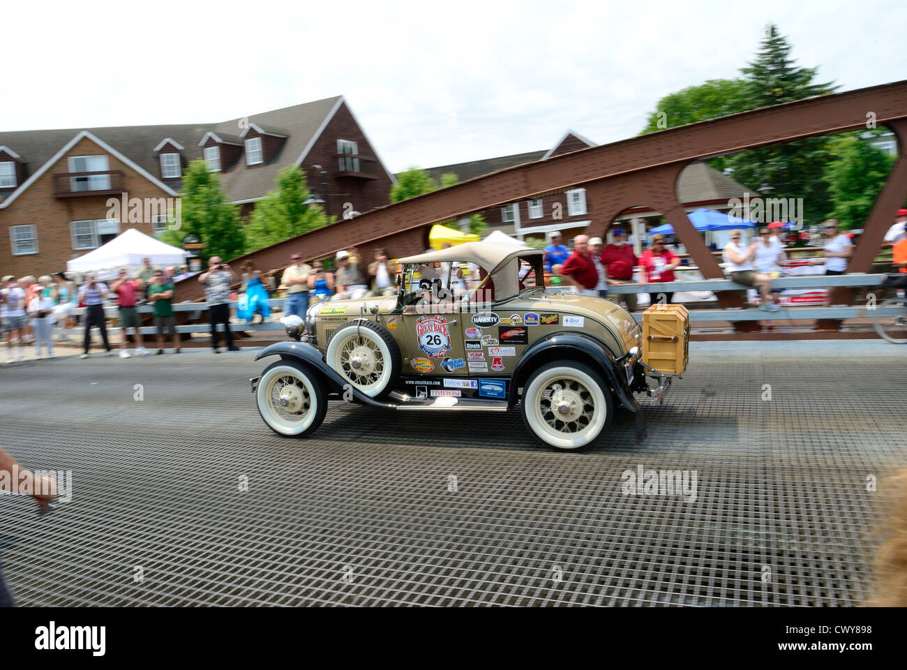 Vintage car fans watch The Great Race in Fairport, NY. Stock Photo