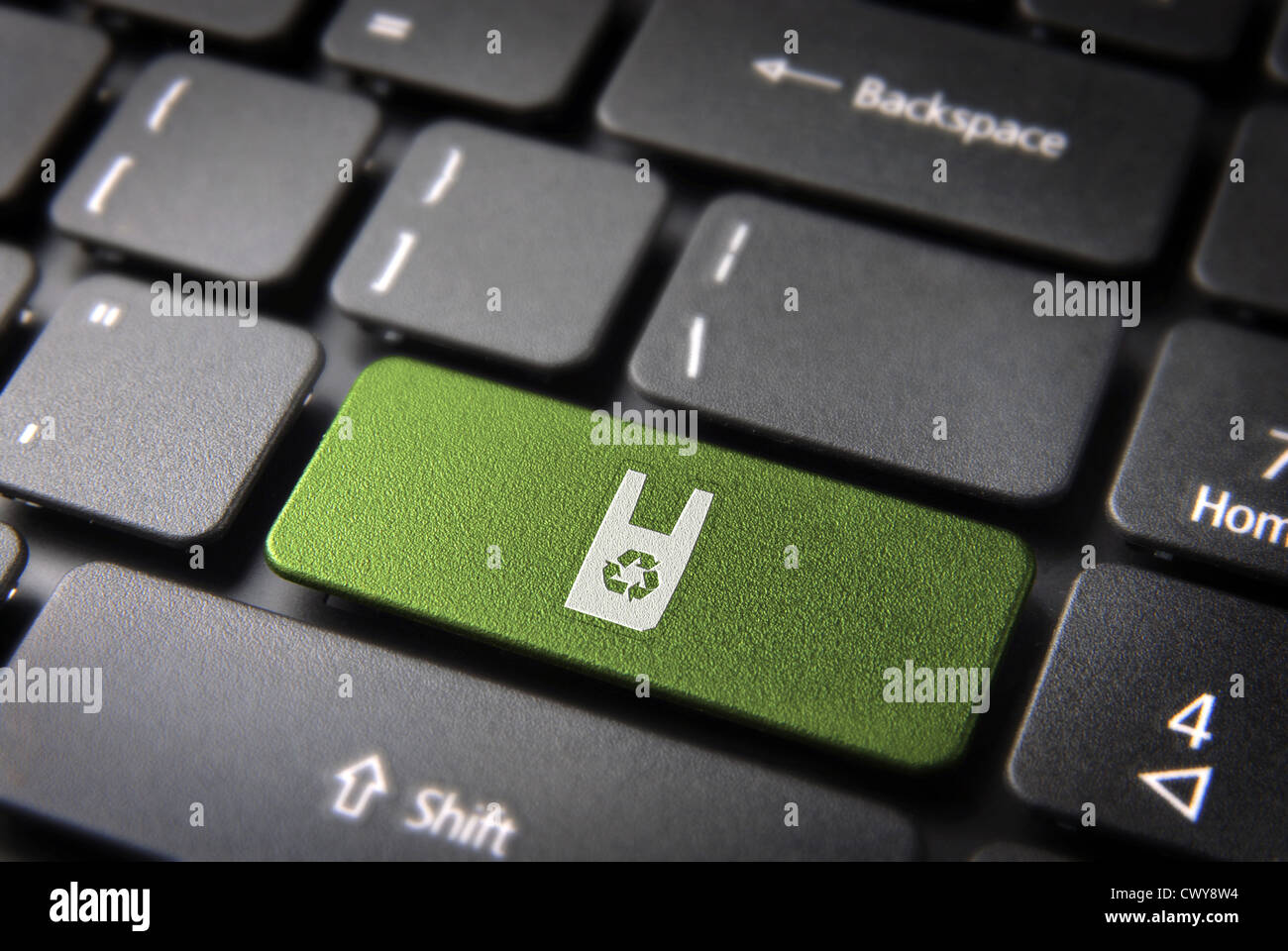 Go green key with recycle plastic bag icon on laptop keyboard. Included clipping path, so you can easily edit it. Stock Photo