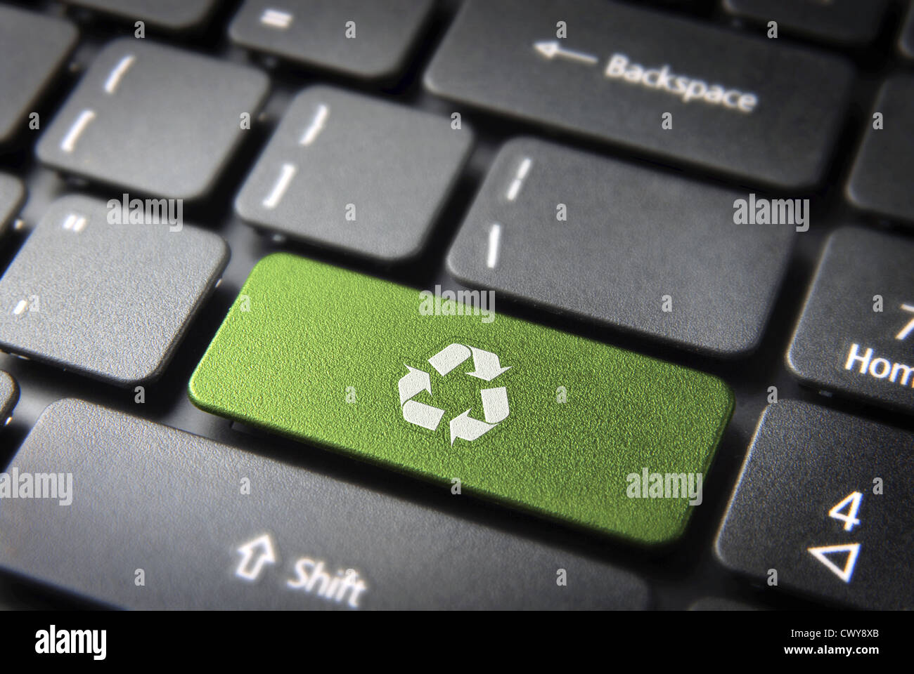 Go green key with wind turbine icon on laptop keyboard. Included clipping path, so you can easily edit it. Stock Photo