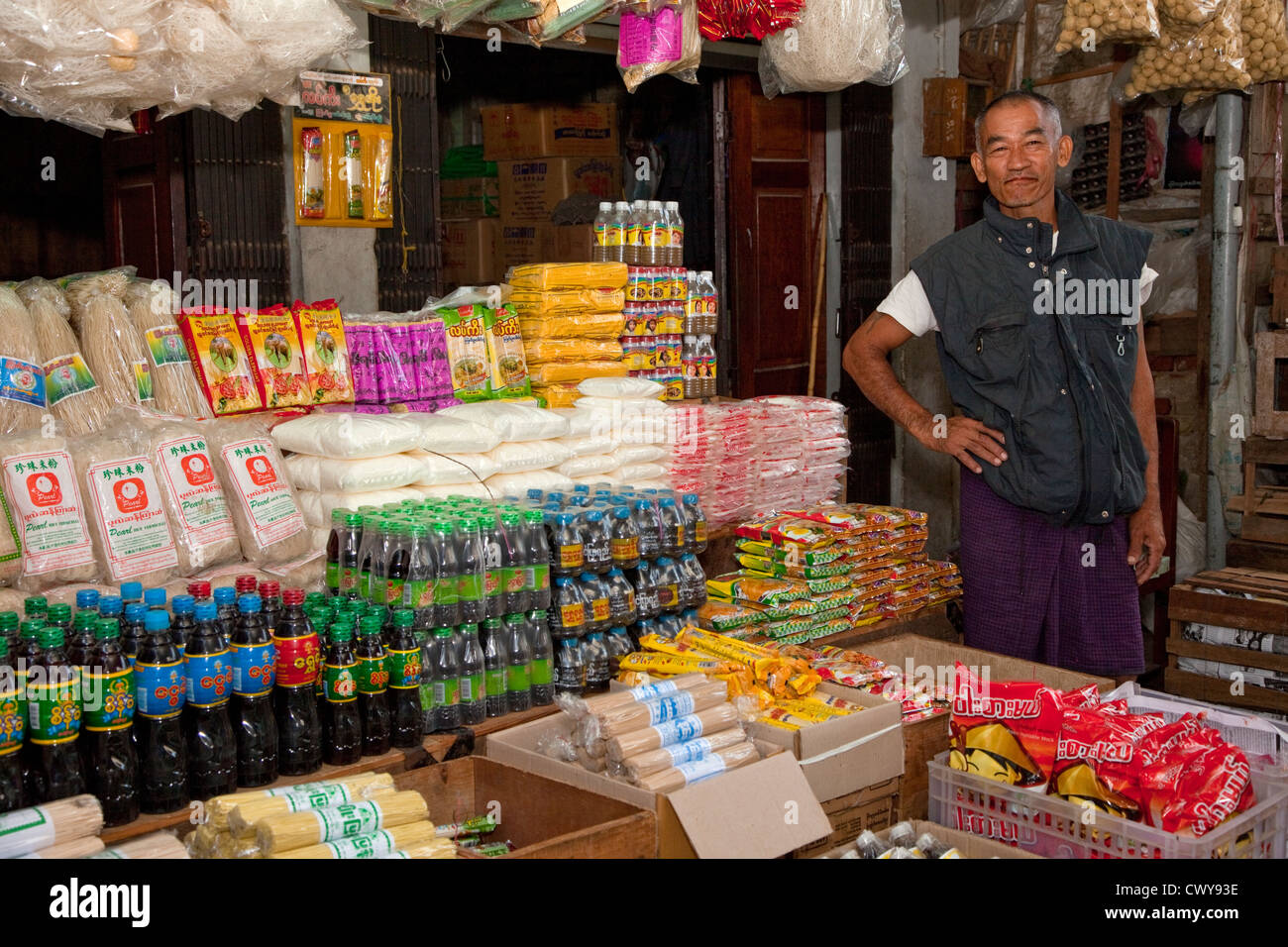 Myanmar, Burma. Mandalay. Drinks and Foodstuffs Vendor. Stock Photo
