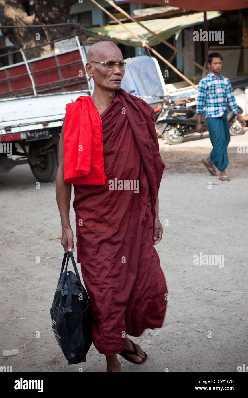 Myanmar, Burma. Mandalay. Buddhist Monk Walking. Monks shave their heads. Stock Photo