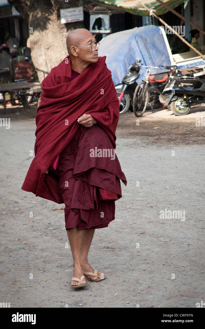 Myanmar, Burma. Mandalay. Buddhist Monk Walking. Monks shave their heads. Stock Photo