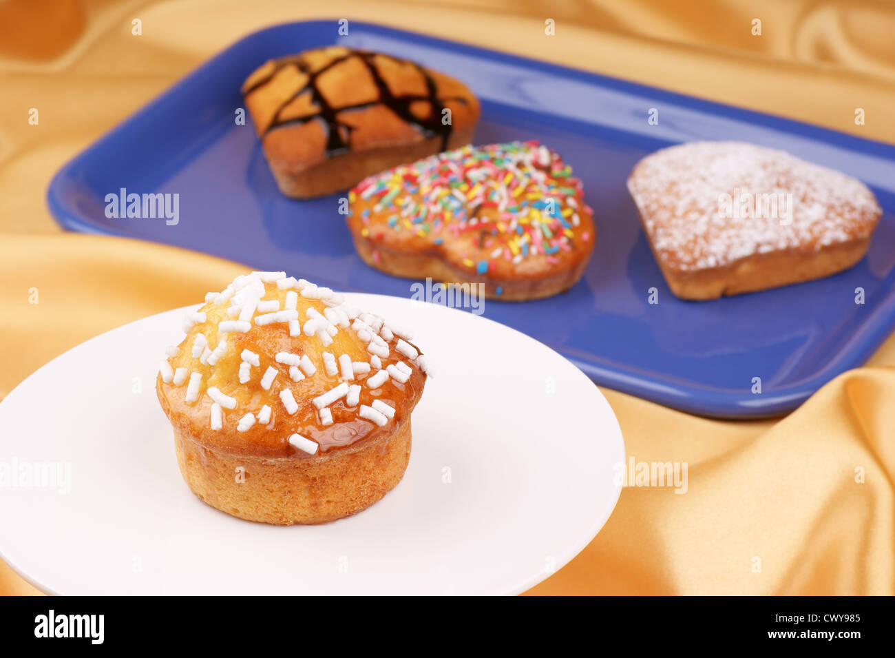 Muffin decorated with sugar grains on a cake stand Stock Photo Alamy