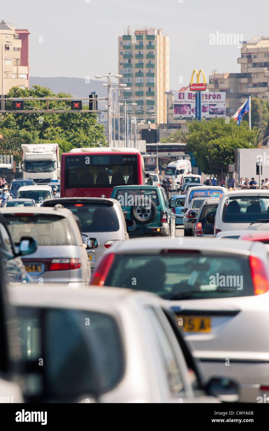 Busy traffic jammed cars crossing Gibraltar Airport runway, frontier