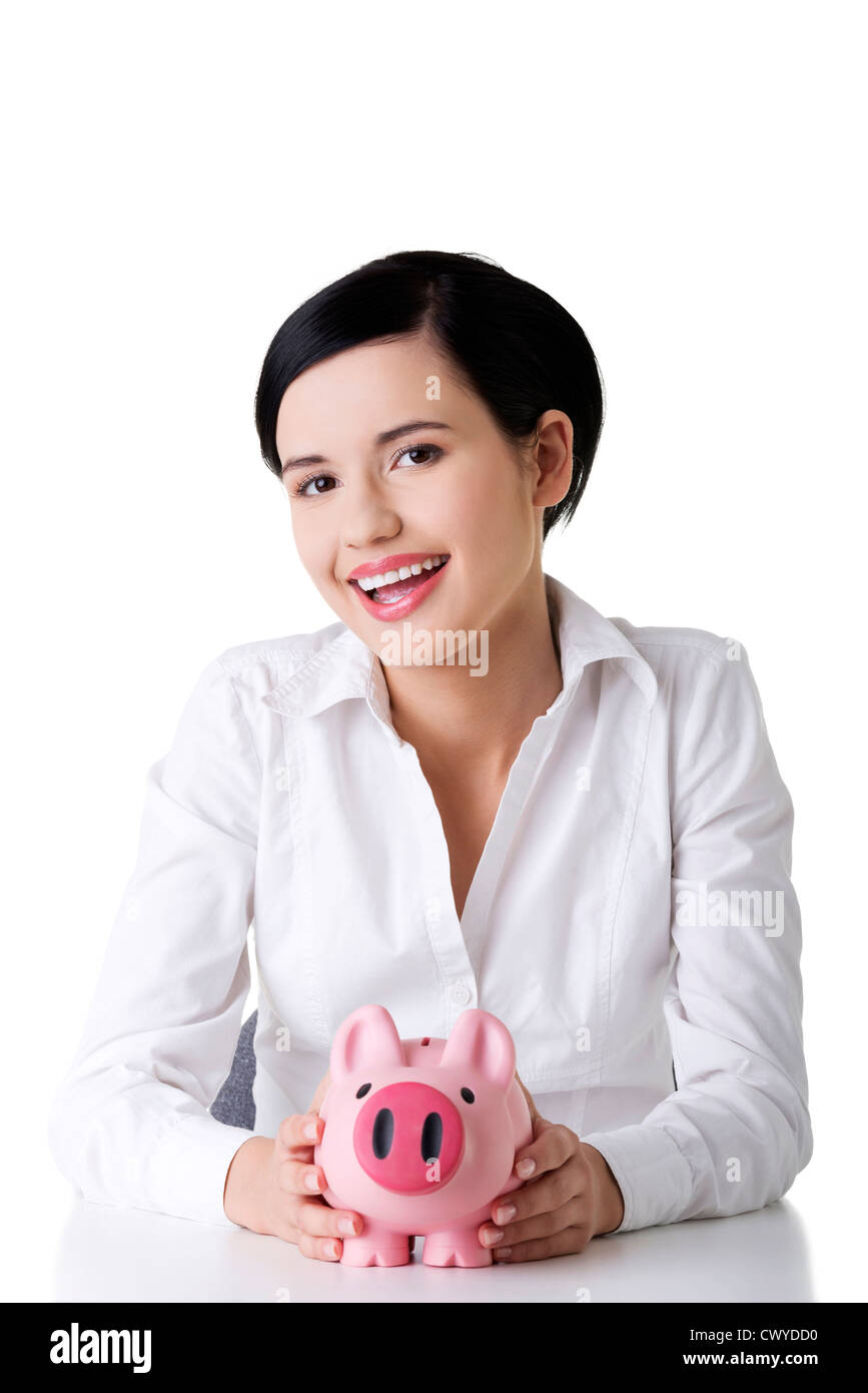 Happy business woman with her savings in piggy bank Stock Photo - Alamy