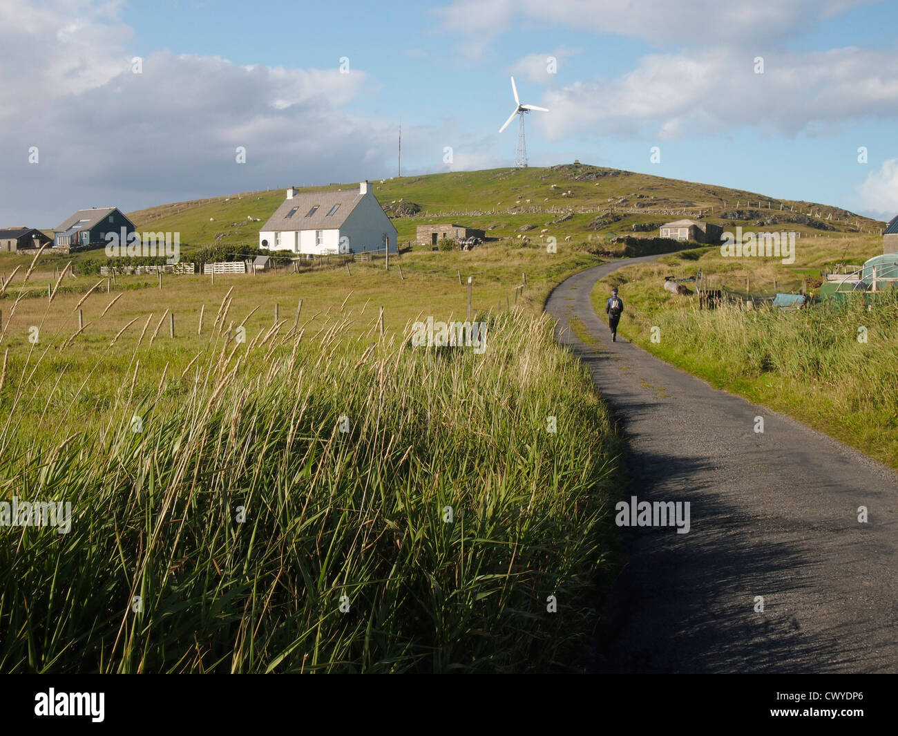 Road and wind turbine, Fair Isle, Scotland Stock Photo