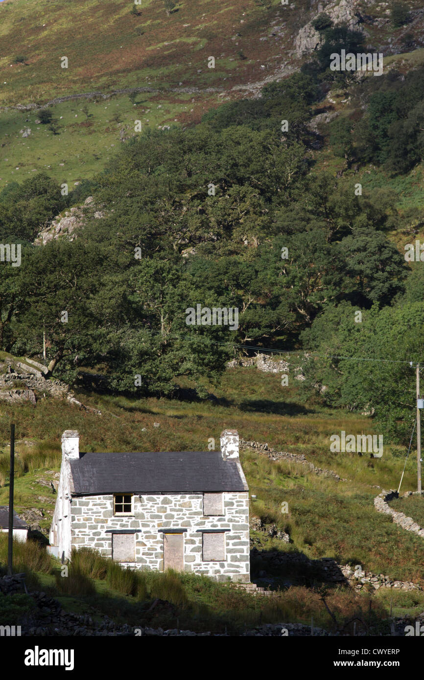 A boarded-up quaint stone cottage at Nant Peris, Snowdonia National Park. Stock Photo