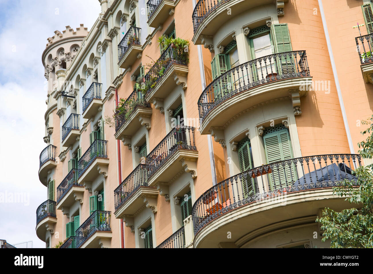 Apartments with wrought iron balconies and exterior wooden shutters in Barcelona Catalonia Spain ES Stock Photo