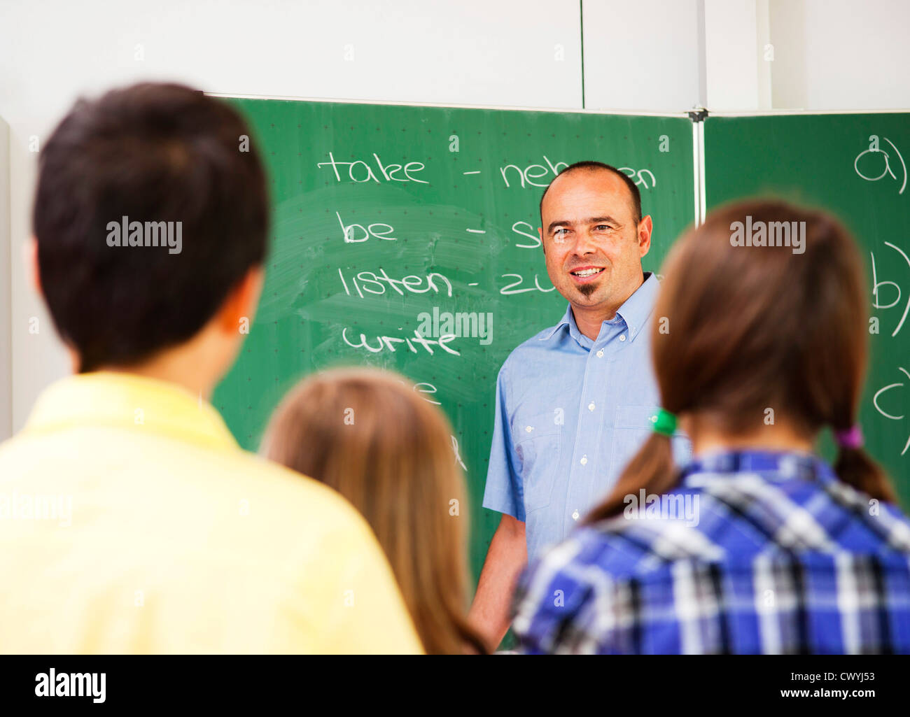 Teacher and pupils in an English lesson Stock Photo