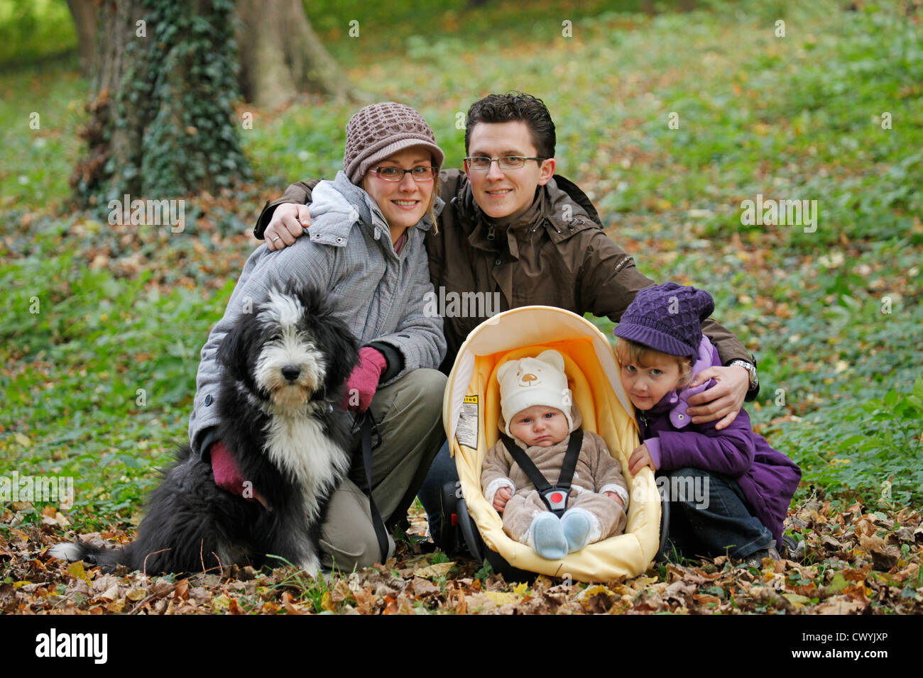 family with Bearded Collie Stock Photo
