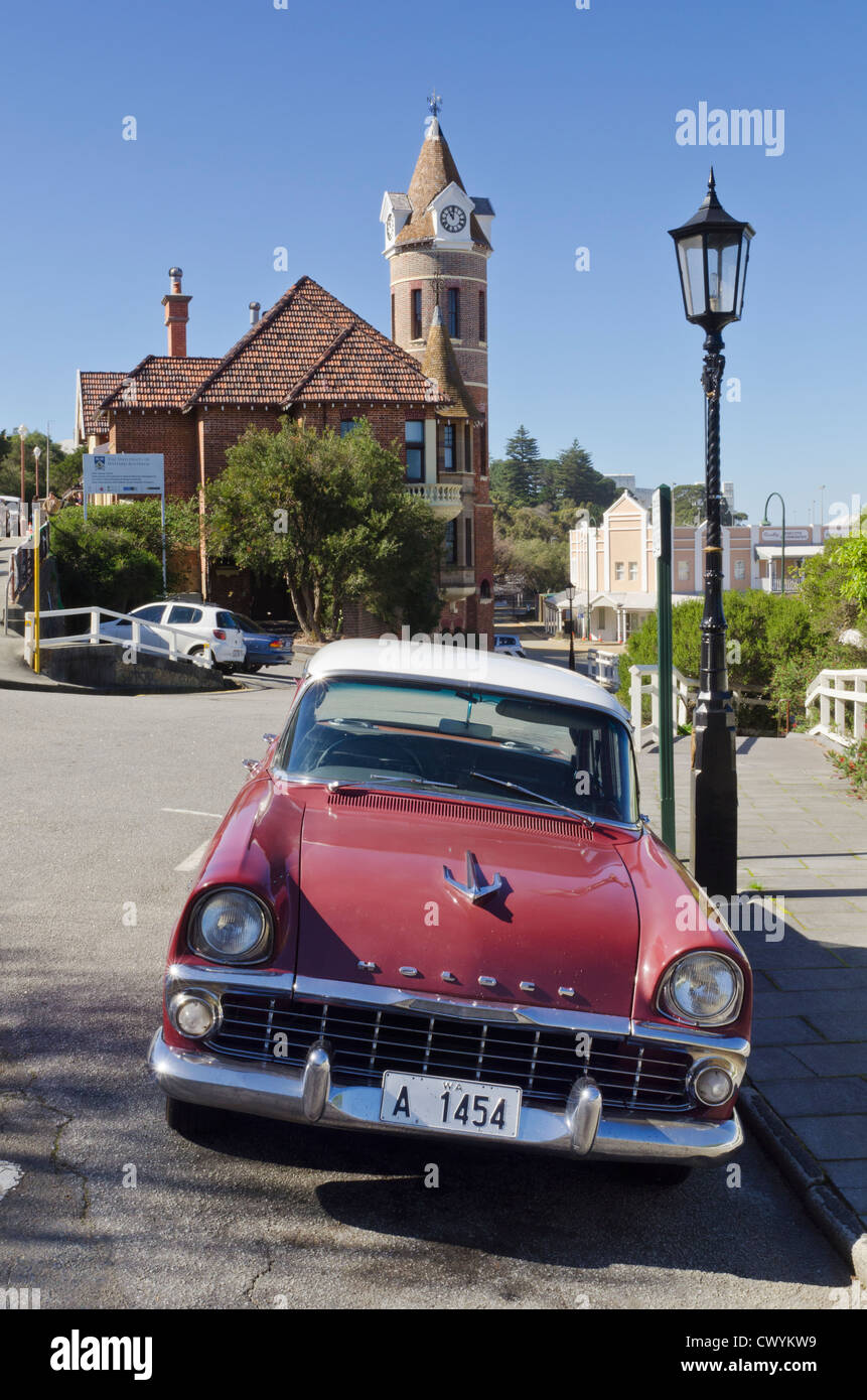 Old Holden EK Special car parked on Stirling Tce, with the clock tower of the old Post Office, Albany, Western Australia Stock Photo