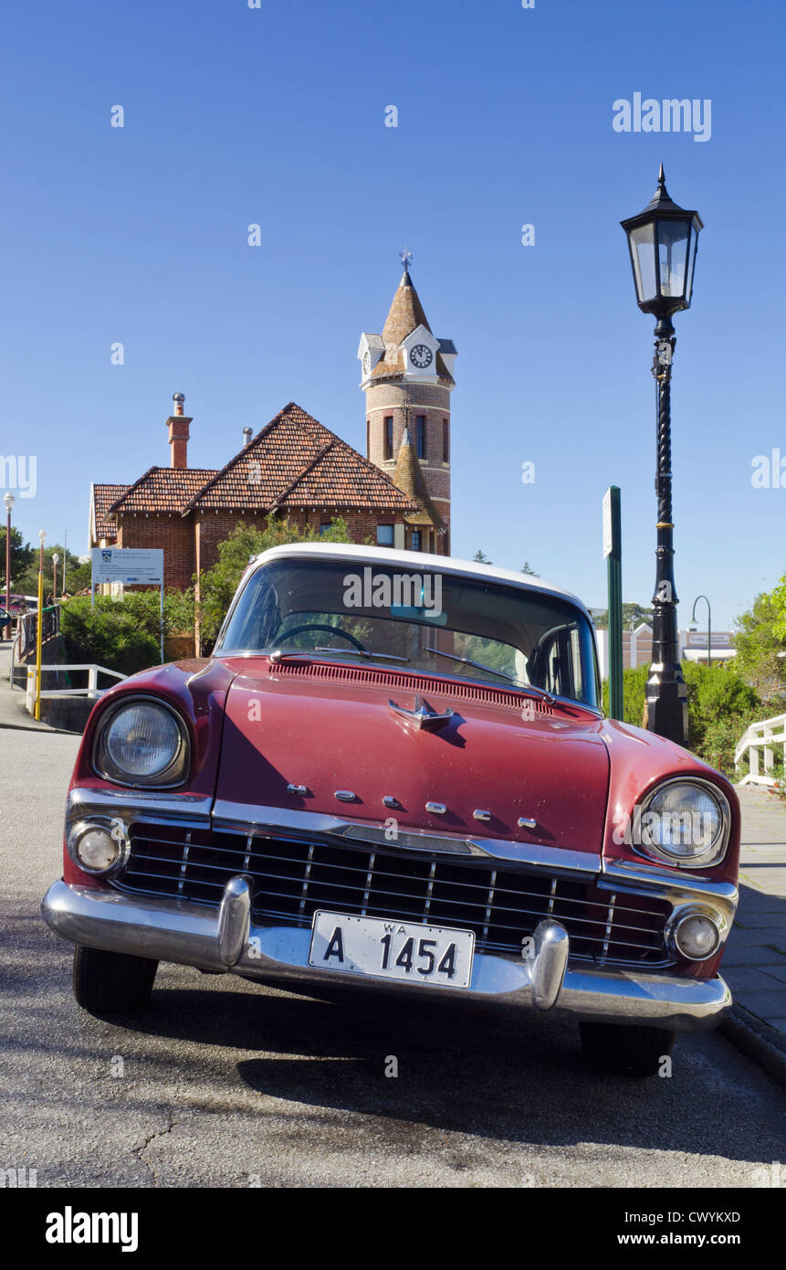 Old Holden EK Special car parked on Stirling Tce, with the clock tower of the old Post Office, Albany, Western Australia Stock Photo