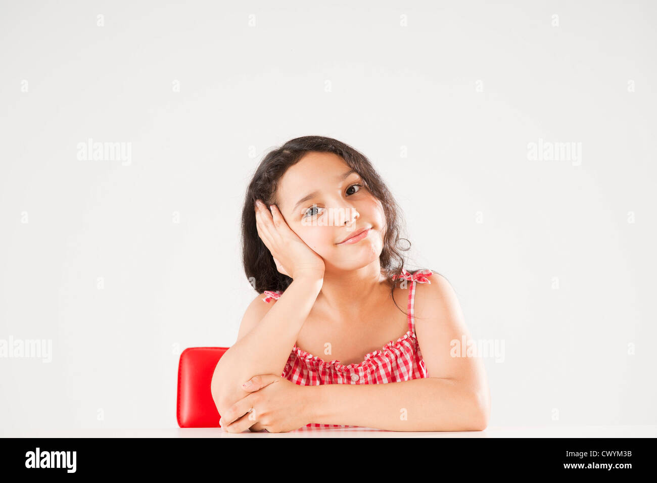 Girl resting her head in hand, portrait Stock Photo - Alamy