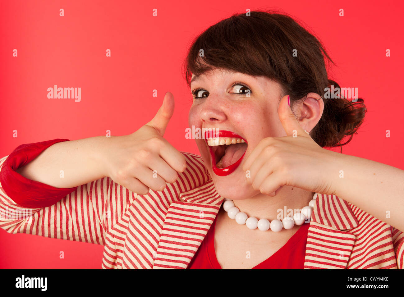 Serious portrait of an young woman on red Stock Photo - Alamy