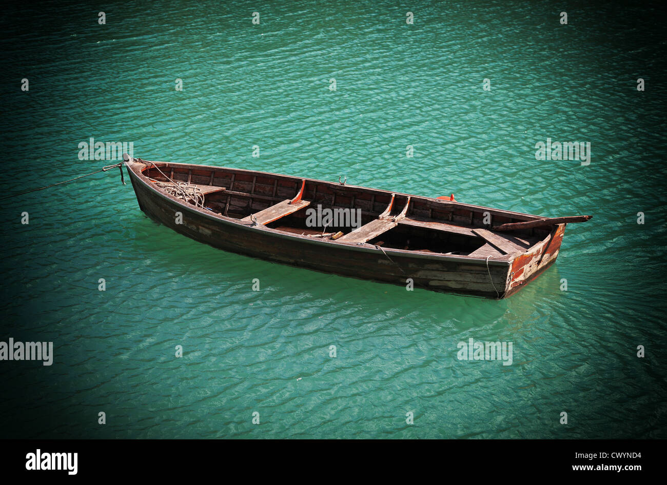 wood boat on green lake Stock Photo