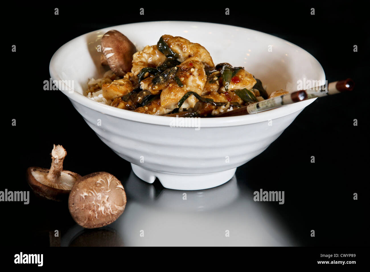 Thai stir fry meal with chicken and mushrooms Stock Photo