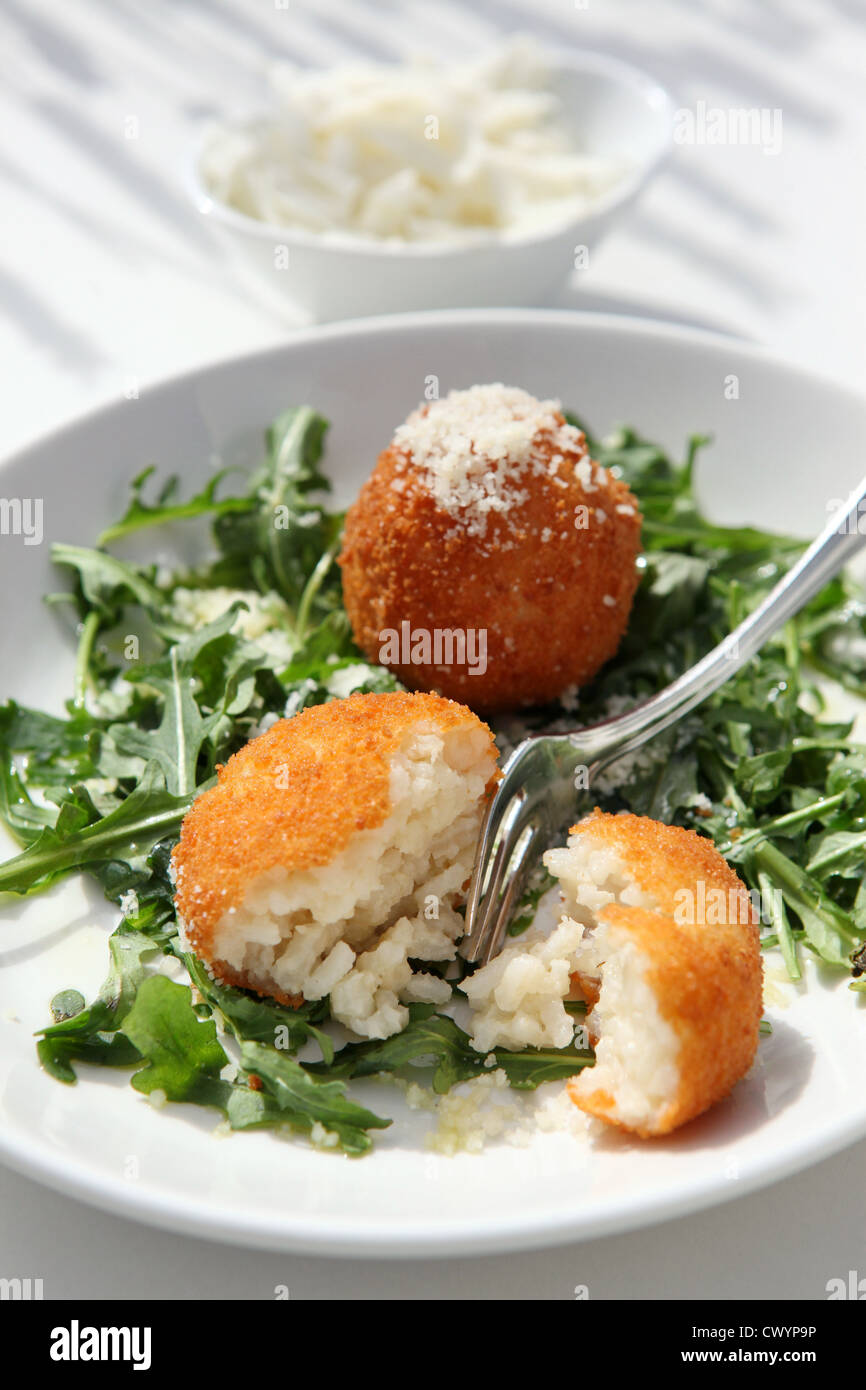 Arancini or arancine fried (or, less commonly, baked) risotto rice