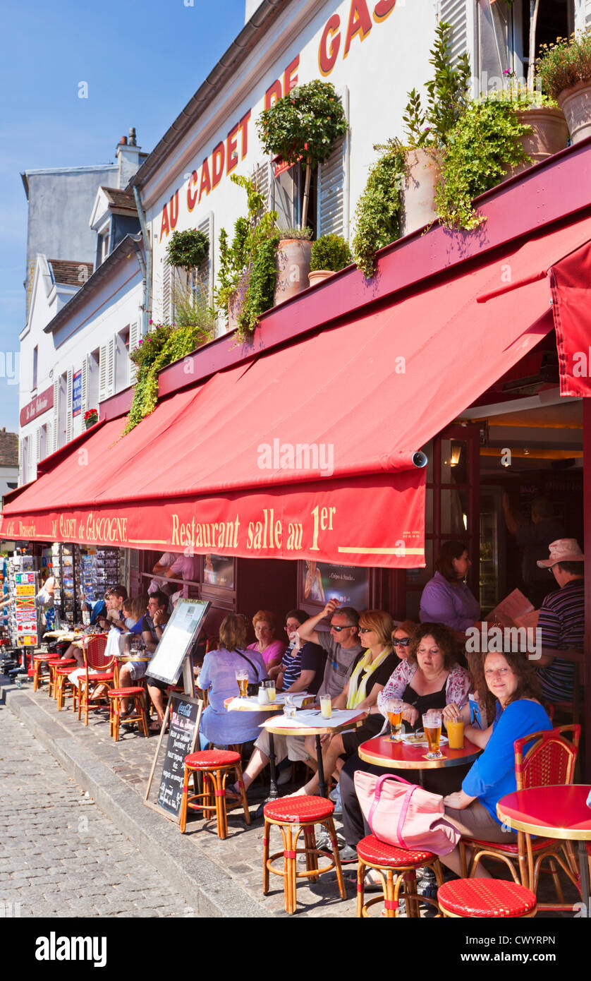People sitting at a pavement cafe in the Place du Tertre Montmartre Paris France EU Europe Stock Photo