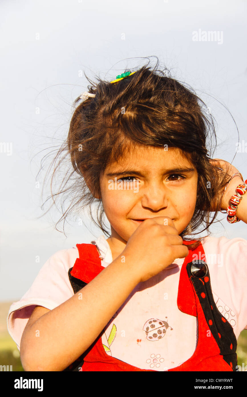 portrait of cute little shy kurdish girl in Hasankeyf , Turkey Stock Photo