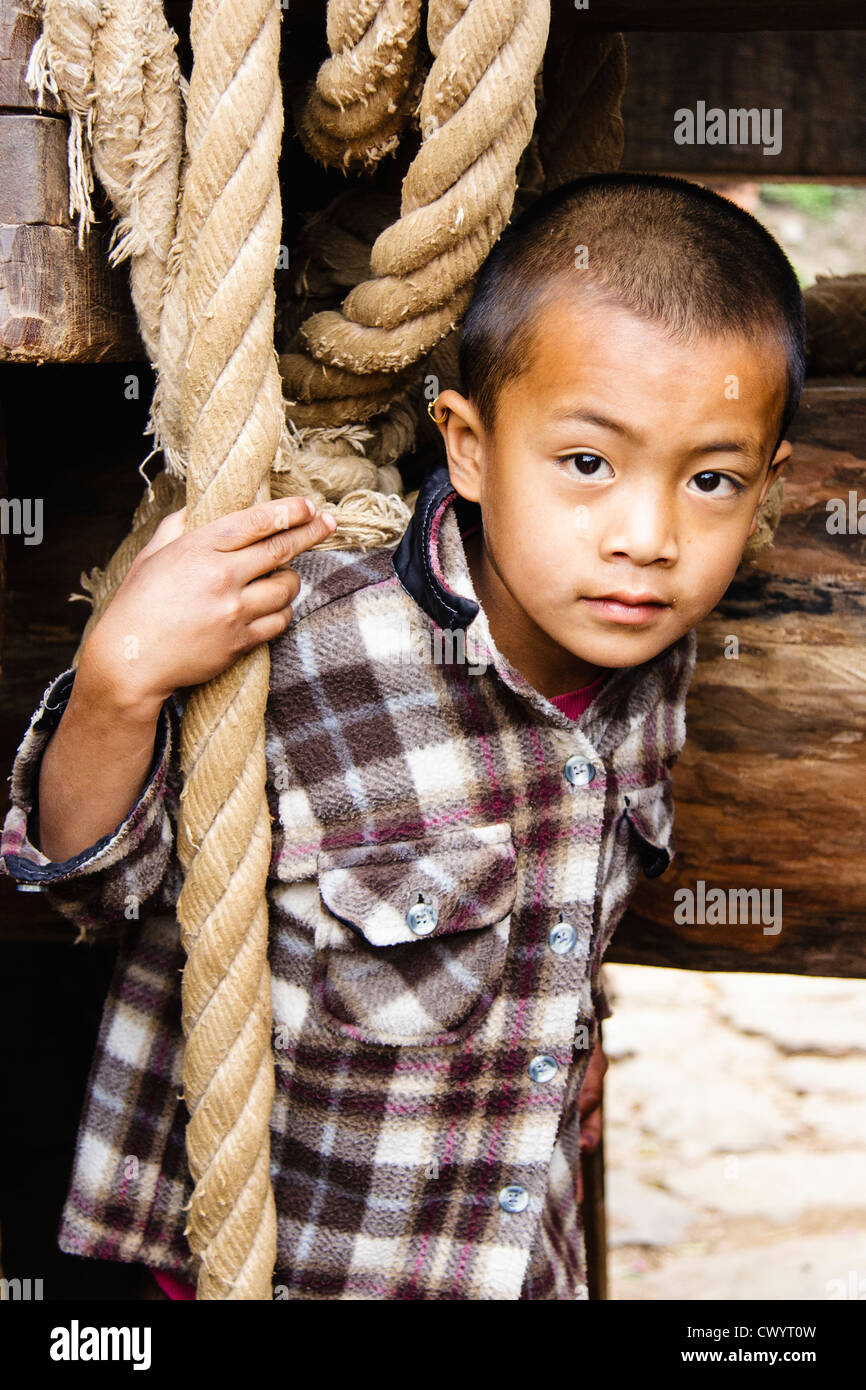 Portrait of Newar boy under the processional chariot of the Bisket Jatra New Year festival. Bhaktapur , Nepal Stock Photo