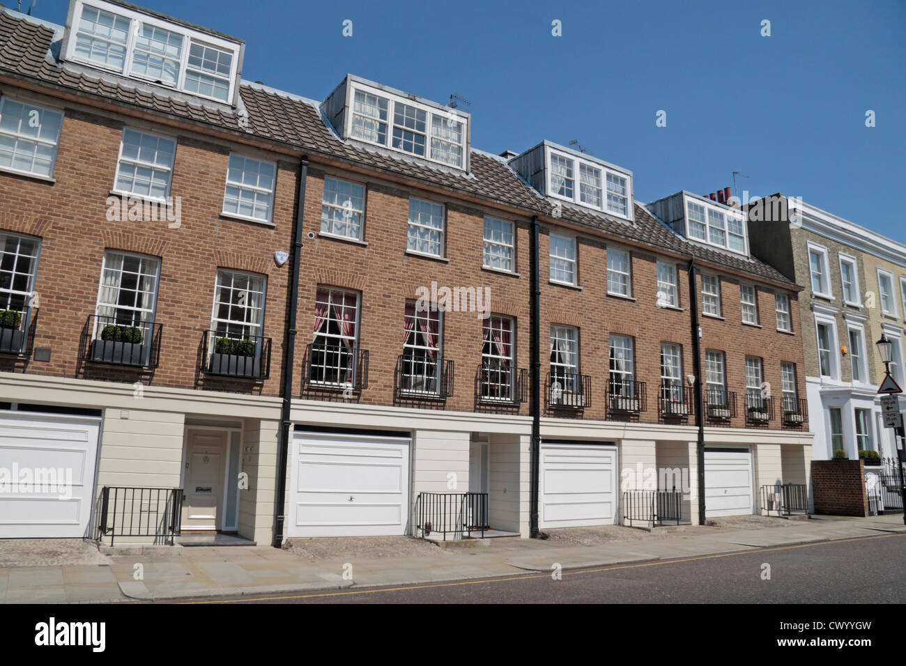 Modern three storey houses with ground floor garages on Shawfield Street, Chelsea, London, SW3, UK. Stock Photo